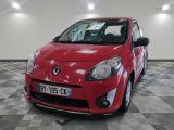 a picture of a red car that is parked in a garage