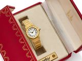 an image of a gold wrist watch in a red box