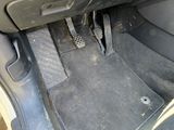 a close up of a car ' s floor with a car floor mat