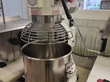 a mixer that is sitting on a counter in a kitchen