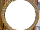 a mirror that is sitting on a table in front of a mirror