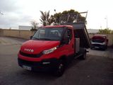 a red truck parked in a parking lot with a solar panel on top of it