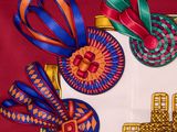 a picture of some ribbons and a cross on a table