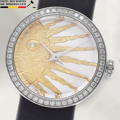 an image of a close up of a wrist watch with a sun dial
