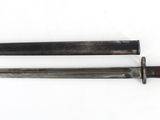 two knives are laying side by side on a white surface