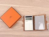 an orange box with a calculator and a calculator in it