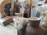 a vase that is sitting on a table next to other items