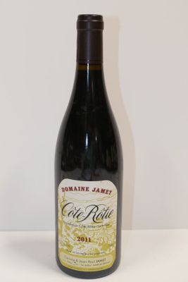 a bottle of wine that is sitting on a table
