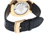 the watch has a gold case and black leather strap