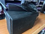 a black box with a power cord on top of it