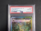 a close up of a pokemon card on a black surface