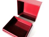 a red box that is open on a white surface
