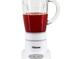 a blender that has a red liquid in it