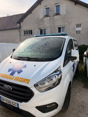 a white van that is parked in front of a building