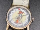 a close up of a wrist watch with a cartoon character on it