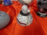three vases that are sitting on a table