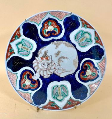 a plate with a picture of a cat and a dog on it