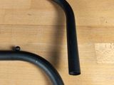 a pair of black bars on a wooden table