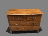 an image of a wooden chest of drawers on a grey background