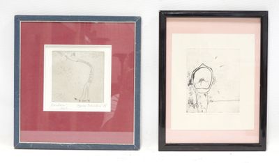 two framed drawings of a woman and a man on a wall