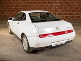 a white car that is parked in a garage