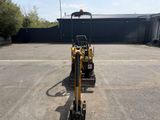 an image of a small construction vehicle parked in a parking lot