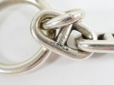 a close up of a metal chain with a knot on it