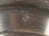 a close up of a metal pan with a handle