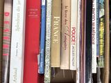 a box full of books that are sitting on the floor