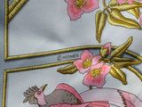 a close up of a tie with a picture of a woman