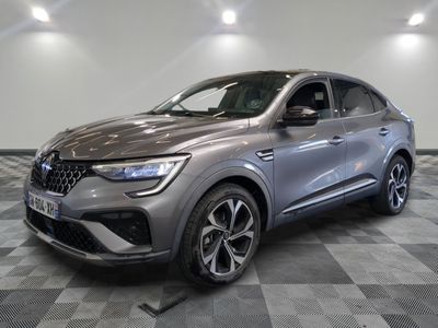 a grey suv parked on a checkered floor in a garage