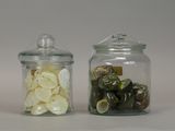 two glass jars with different types of food in them