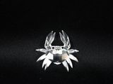 silver plated crab brooch with clear crystals on black background