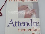 the book is on a table with a red string