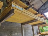 a picture of a building under construction with wooden beams