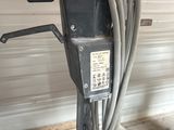 a machine that is sitting on a shelf in a garage