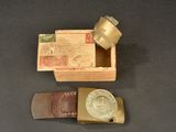 a small wooden box with a metal object inside of it