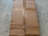 a cardboard box sitting on the floor in a warehouse