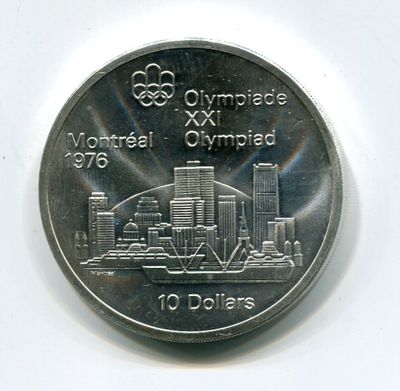 une pièce commémorative des Jeux Olympiques sur laquelle figure, en arrière-plan, l'image d'une ville