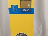 a yellow vending machine sitting on a white surface