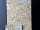 several pieces of plywood are stacked on a pallet in a warehouse