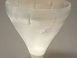 a glass vase that has a lot of liquid inside of it