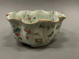 a small bowl that has a flower design on it