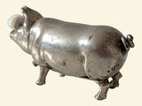 a silver pig statue on a white background