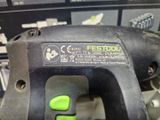 a close up of a corded drill on a table