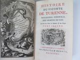 a book with a picture of a coat of arms on it