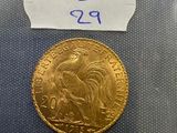 a close up of a gold coin with a label on it