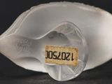 a close up of a glass vase with a label on it