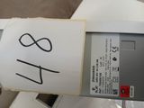 a hand holding a sign that says it is a parking meter