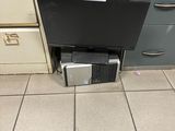 a computer that is sitting in the middle of the floor